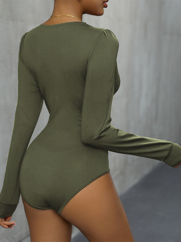 A woman wearing a olive green long sleeve bodysuit with lace detailing